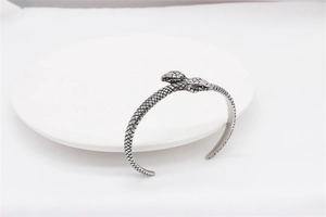 Detailed close-up of retro punk snake bracelet showing intricate scale engraving