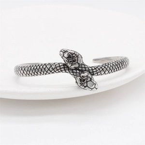 Retro stainless steel double-headed snake open bangle with detailed scale texture