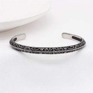 Vintage oxidized titanium steel cuff bracelet with intricate hollow filigree detailing