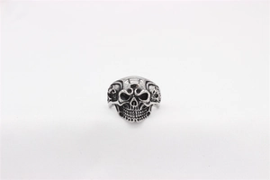 Macro detail of gothic skull ring with vintage oxidized finish and side relief carving