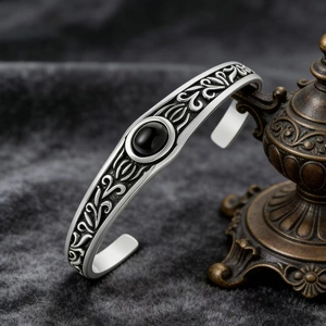 Vintage silver steel cuff bracelet with black gemstone and ethnic relief patterns