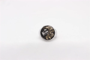 Macro shot of men's vintage lion head ring with gold relief and black enamel finish