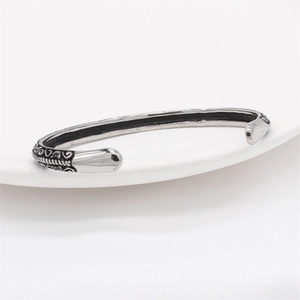 Vintage stainless steel cuff bracelet with woven texture and bullet-shaped ends for men