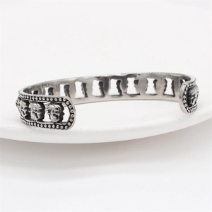 Vintage stainless steel skull cuff bracelet for men featuring a punk gothic hollow design