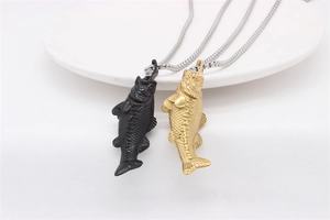 Detail of vintage goldfish pendants in black and gold finish with fine scales and box chain