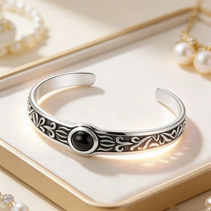 Retro stainless steel open cuff bracelet for men featuring a black gemstone and carvings