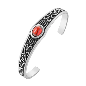 Vintage silver mens bangle with engraved floral patterns and central oval red gemstone