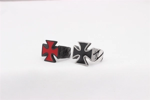 Detail view of retro gothic stainless steel cross rings in red and black colors
