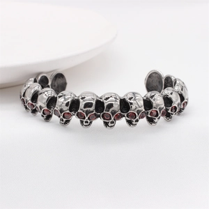 Retro punk skull cuff bracelet in vintage steel finish with red zircon stone eyes
