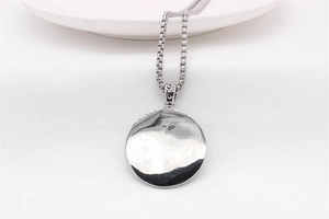 Polished silver stainless steel round pendant necklace with box chain on white background