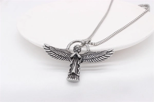 Detailed close-up of retro stainless steel Cupid angel pendant with oxidized finish