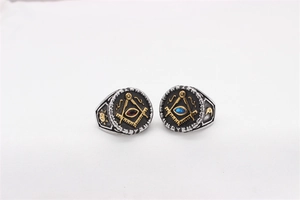 Macro shot of Freemasonry rings featuring blue and red stones with vintage sun and moon engravings