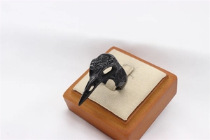Macro view of a black viking raven skull ring with detailed Celtic knot engravings