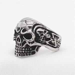 Retro stainless steel skull ring with vintage silver finish and punk rock carved details