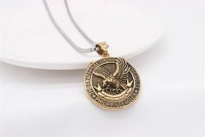 Detail of vintage eagle medallion pendant with The Fraternal Order of Eagles engraving