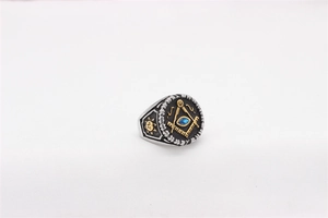 Detail of Masonic stainless steel ring with blue stone and compass symbol engraving