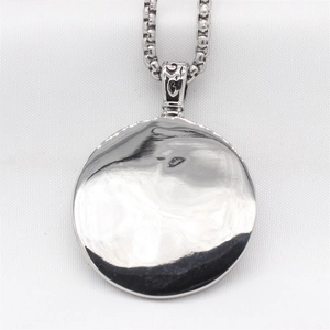 Vintage Viking wolf pendant for men in silver steel with a polished round mirror finish