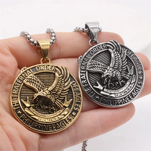 Vintage eagle pendant necklace in gold and silver finish with embossed medallion design