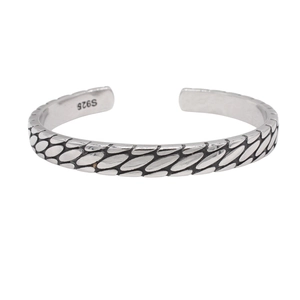 Vintage men's silver cuff bracelet with intricate scale weave texture on white background