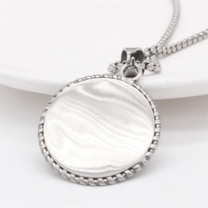 Vintage silver eagle round pendant necklace with textured wave pattern and twisted edge