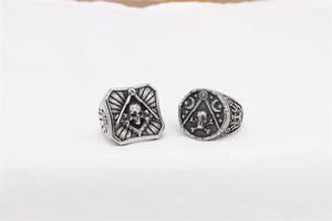 Detailed macro view of vintage skull rings with masonic and mystical engraving symbols