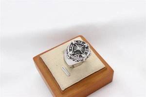 Top view of a vintage stainless steel compass ring with antique silver finish details