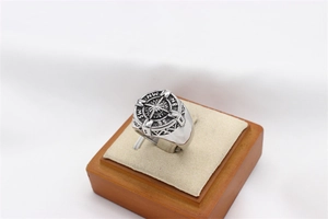 Macro detail of vintage nautical compass ring with engraved north south east west markers