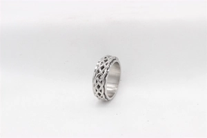 Detail view showing the Celtic knot pattern on a rotating stainless steel spinner ring