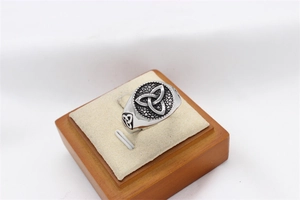 Detailed close-up of a vintage Viking ring featuring a carved Celtic Triquetra symbol