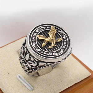 Vintage silver mens eagle signet ring with gold relief and engraved vine patterns