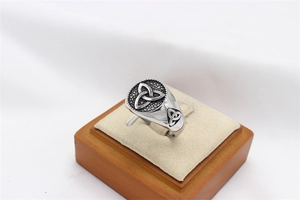 Macro shot of vintage Viking steel ring featuring black frosted Triquetra Celtic knot design