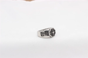 Detailed macro view of vintage compass pattern and Celtic knot on steel ring