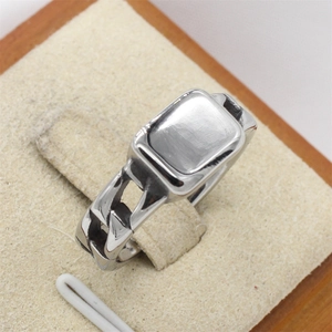 Minimalist silver steel ring with flat rectangular top and Cuban link chain band