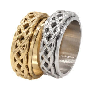 Men's titanium steel spinner rings with Celtic knot texture in gold and silver finish
