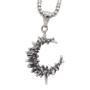 Vintage gothic punk crescent moon pendant with sharp spikes on a steel chain