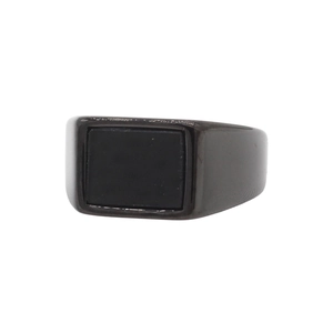 Detailed close-up of a men's minimalist titanium steel ring with black rectangular stone