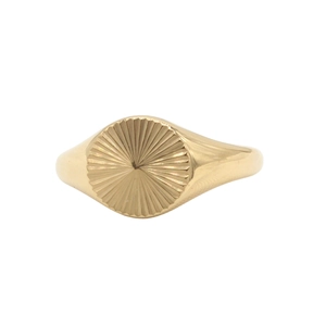 Minimalist gold round signet ring with engraved sunburst texture on a white background