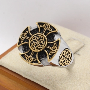 Men's vintage Viking Celtic cross ring in tri-color stainless steel on a jewelry stand