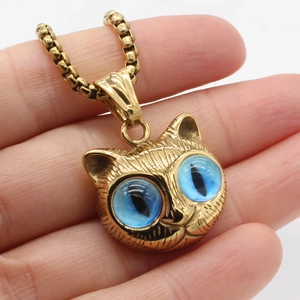 Retro cat pendant necklace with blue feline eyes and golden textured chain detail