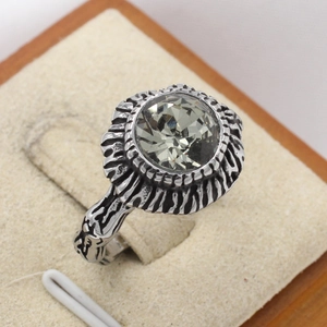 Retro stainless steel men's ring with a large grey faceted gemstone and sunburst texture