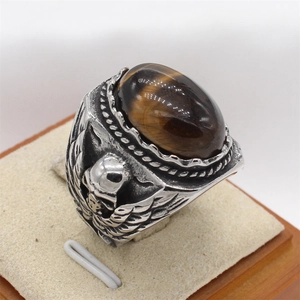 Retro stainless steel ring with oval tiger eye stone and skull wing carvings
