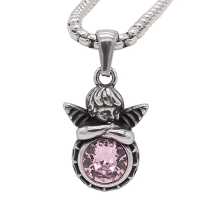 Close-up of retro silver angel pendant with a large sparkling pink gemstone on a snake chain