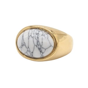 Macro shot of oval white marble stone inlay on a wide gold titanium steel ring band