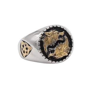 Macro detail of vintage Viking wolf signet ring with gold-tone Celtic knot on side