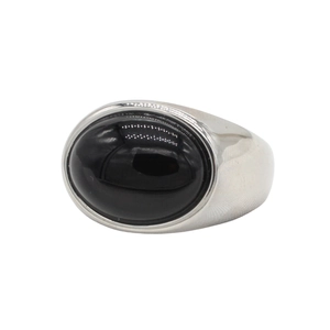 Detailed view of polished oval black gemstone set in a minimalist silver steel ring