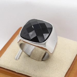 Polished silver stainless steel signet ring for men featuring a faceted black gemstone inlay