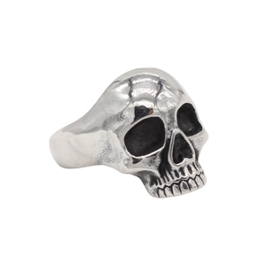 Vintage silver skull ring for men with punk rock details on a clean white background