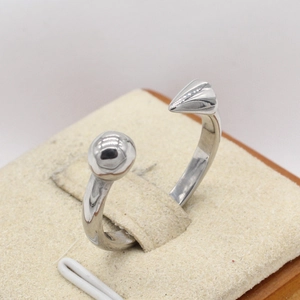Modern silver titanium steel open ring with metal sphere and textured tapered end