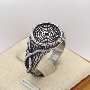 Retro tree of life ring with silver annual ring texture on jewelry display