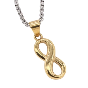 Polished gold infinity symbol pendant necklace with silver box chain on white background
